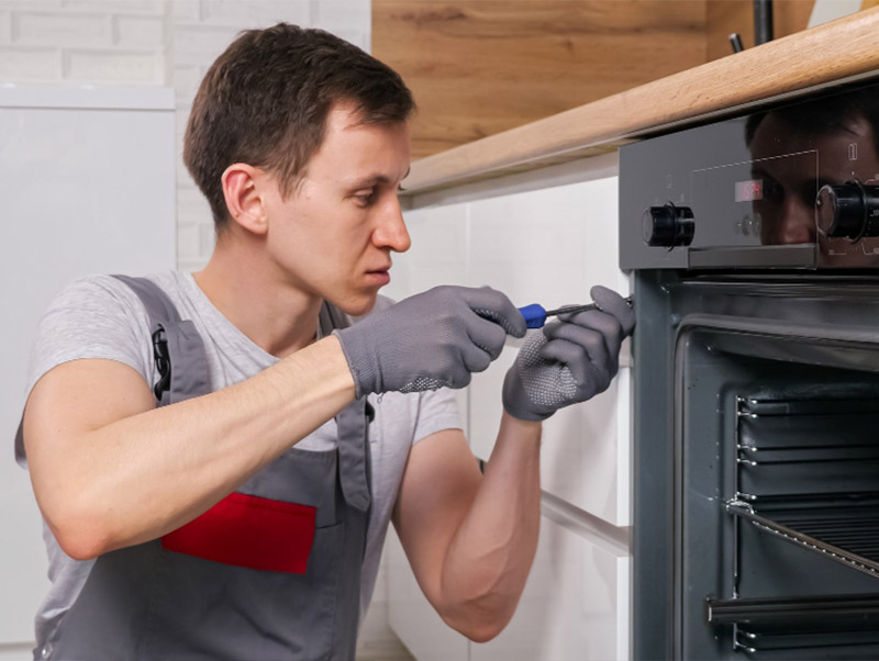 Technican repairing the Westinghouse oven in the kitchen